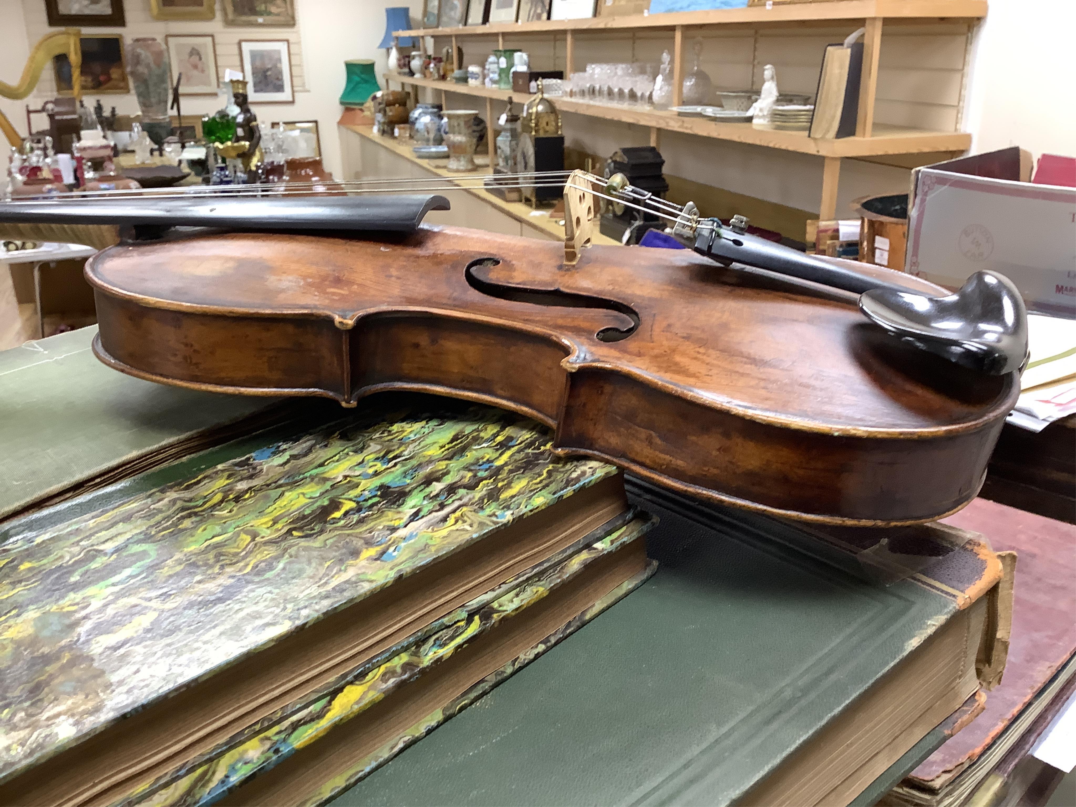 An interesting late 18th century violin, with one piece bird’s eye maple back, unsigned, with two silver fully mounted octagonal bows, one stamped Voight CITES Submission reference, 3XFNUBT7 and Submission reference, RHL